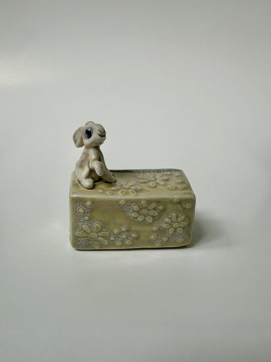 Rabbit on a flowery box - wall hanging