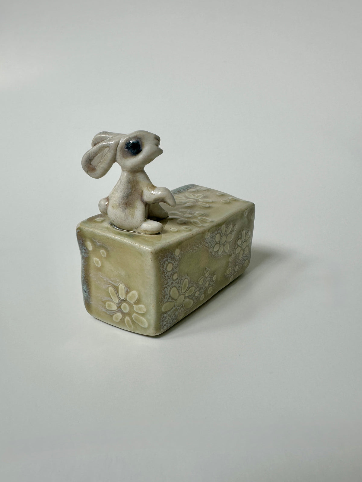 Rabbit on a flowery box - wall hanging