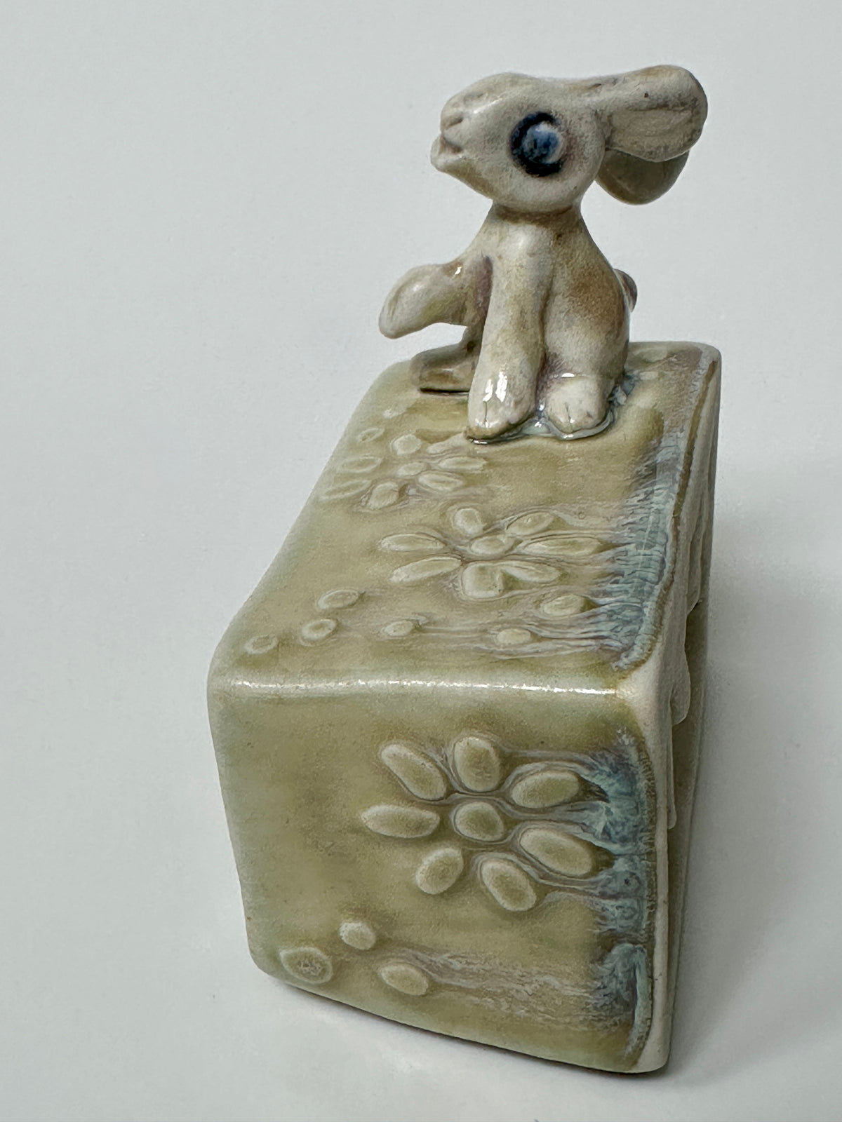 Rabbit on a flowery box - wall hanging