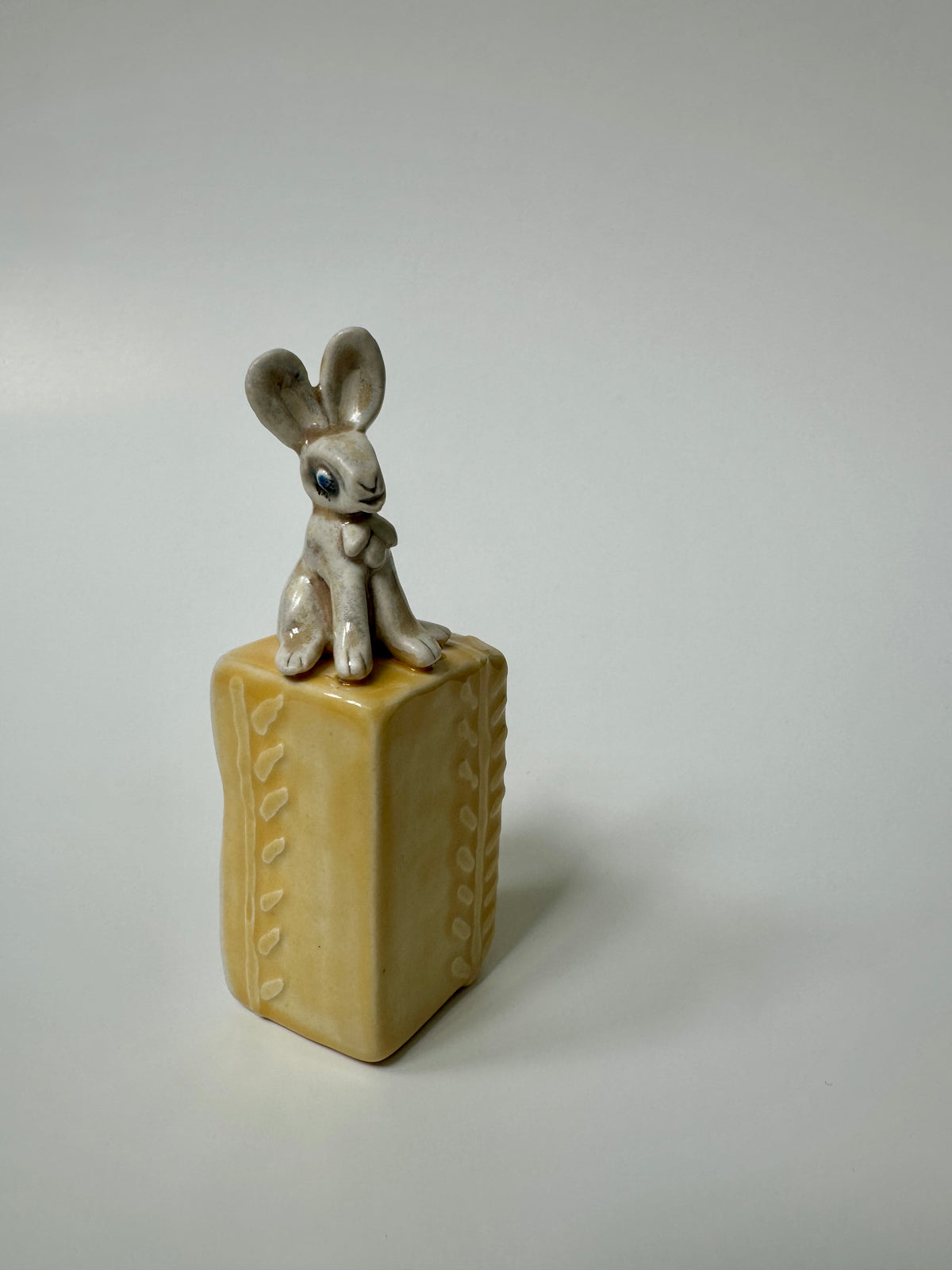 Rabbit on yellow box -wall hanging