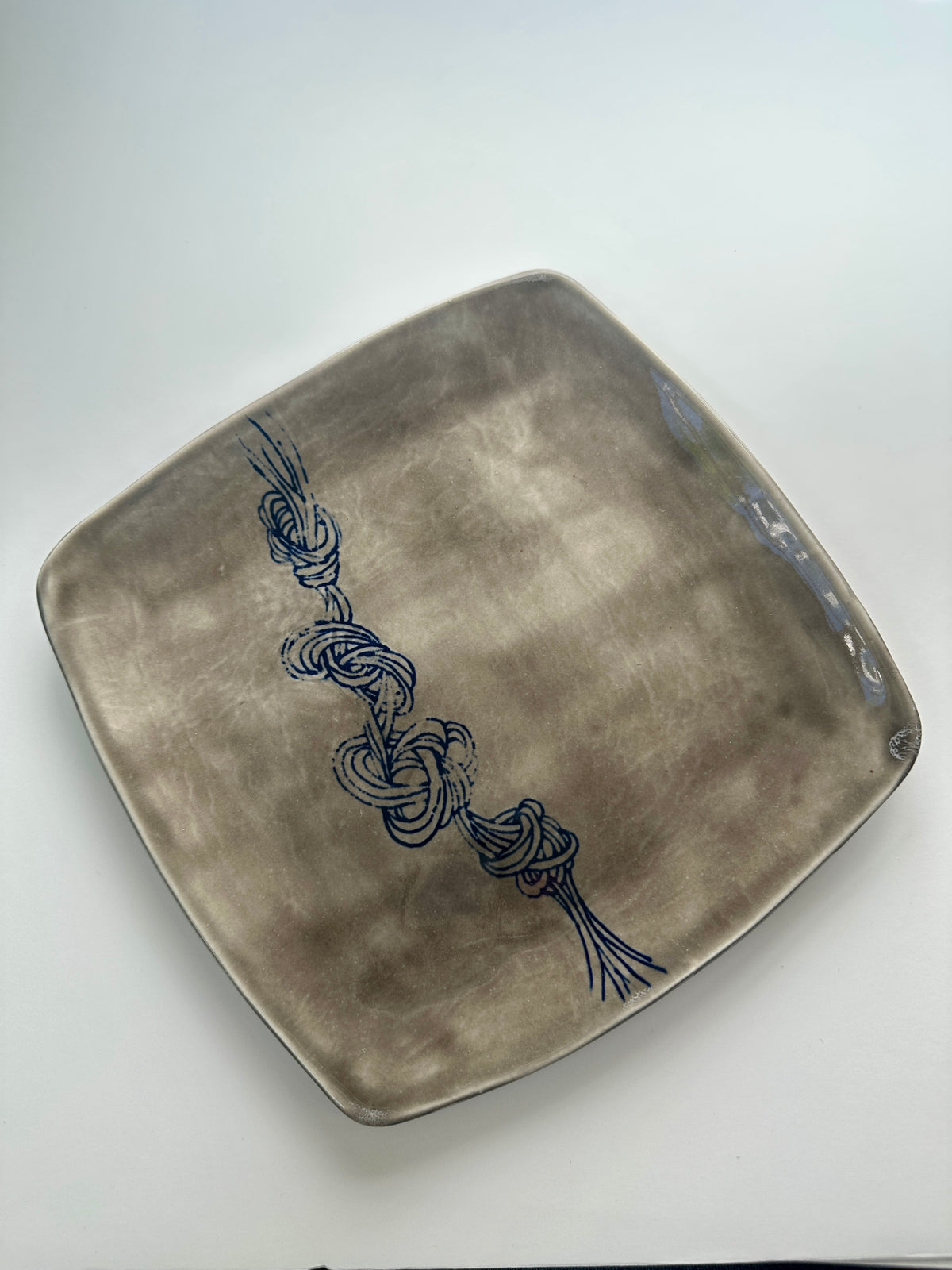 Grey square knot plate