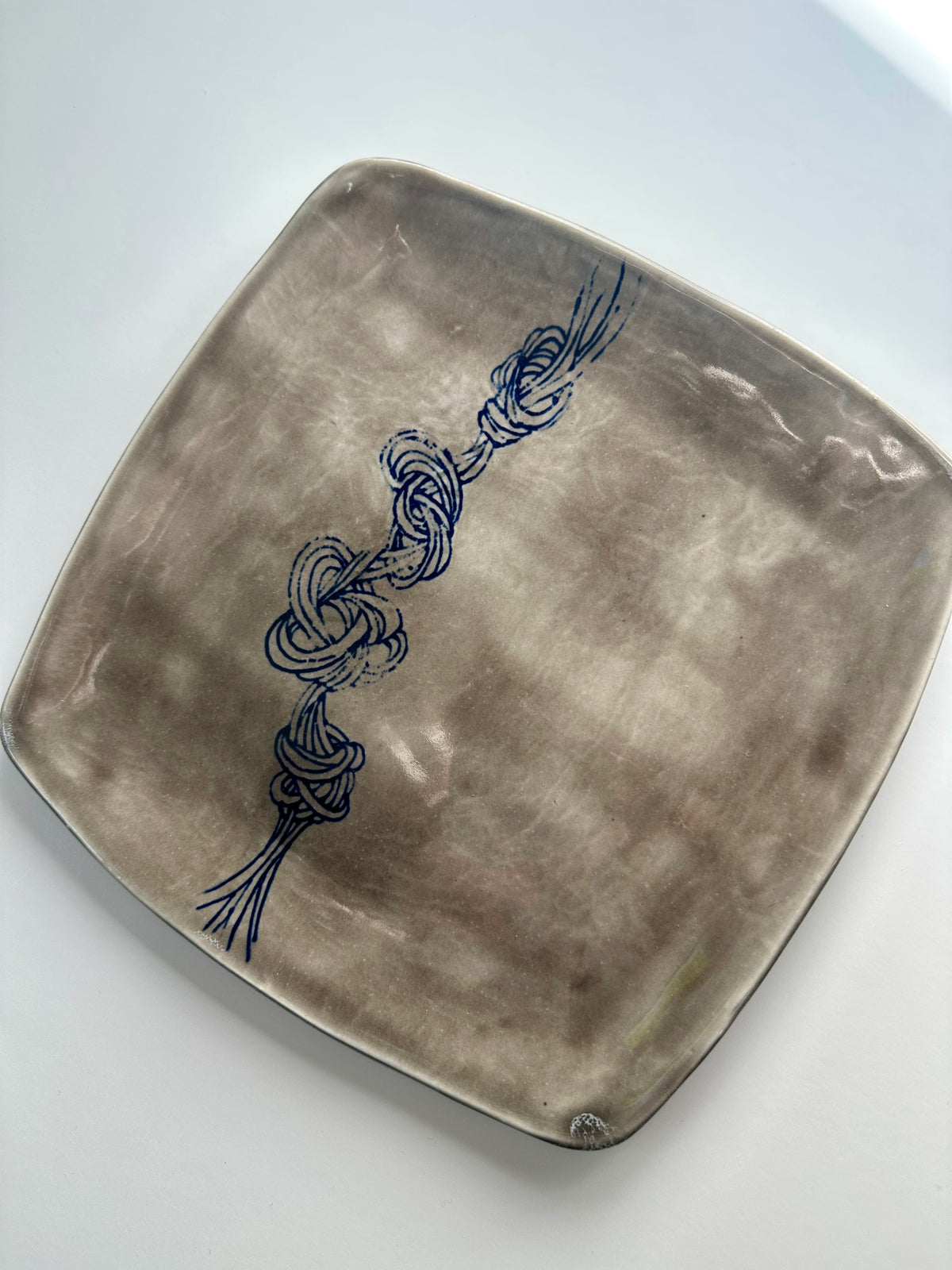 Grey square knot plate