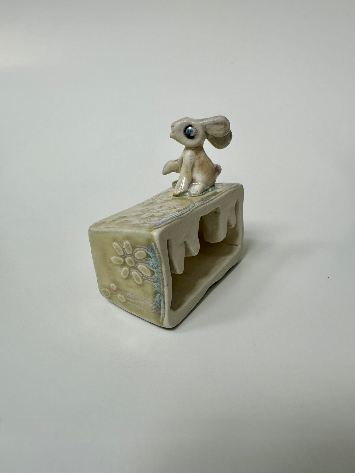 Rabbit on a flowery box - wall hanging