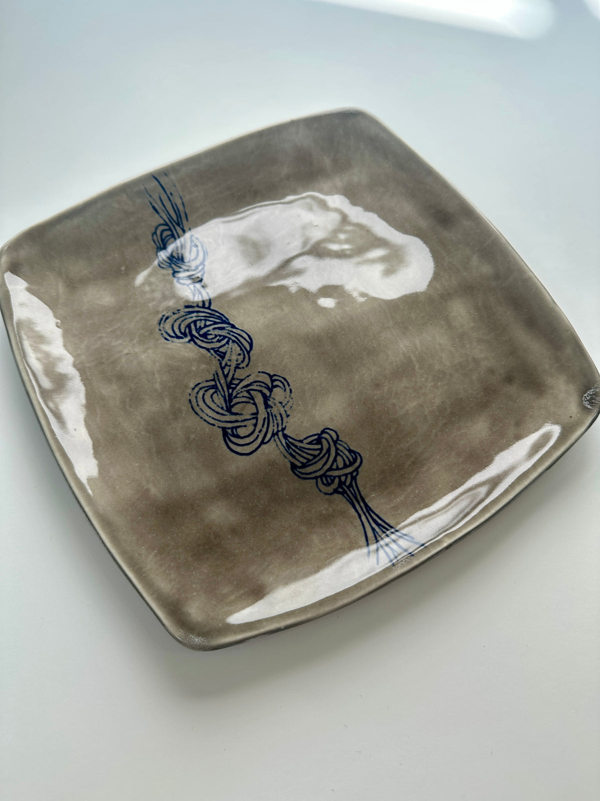 Grey square knot plate