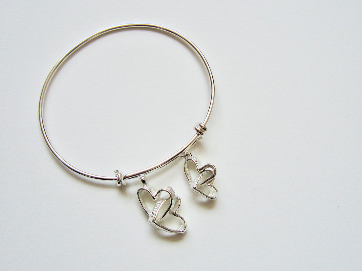 Intertwined Hearts - adjustable bracelet - Amanda Schoppel Art & Wax Carving