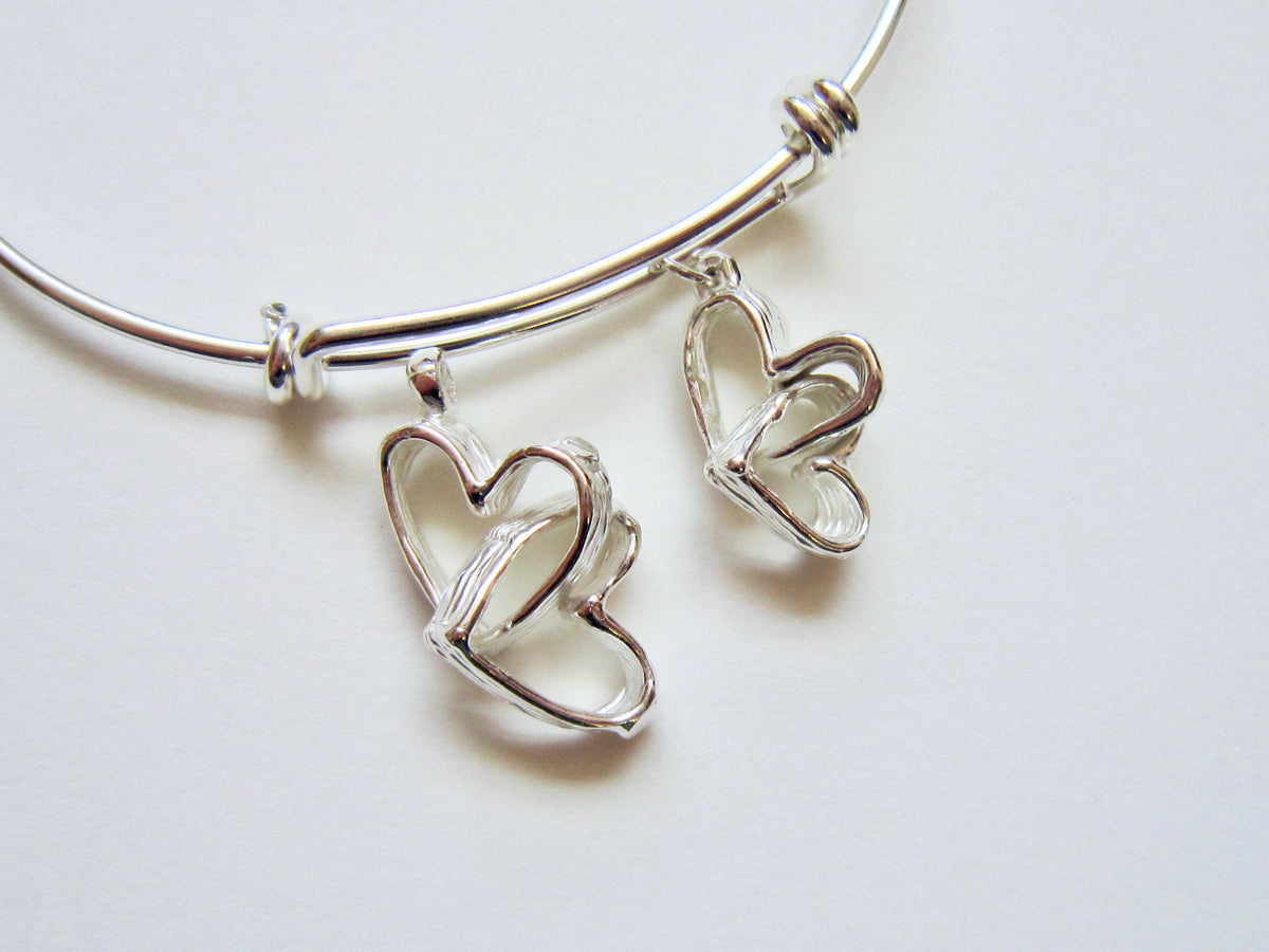 Intertwined Hearts - adjustable bracelet - Amanda Schoppel Art & Wax Carving
